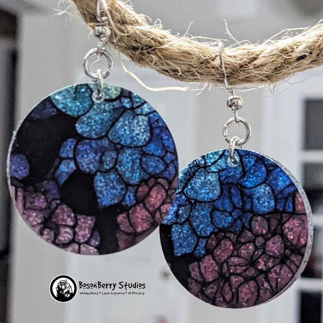Round Hydrangea Glitter Acrylic Earrings suspended from rope