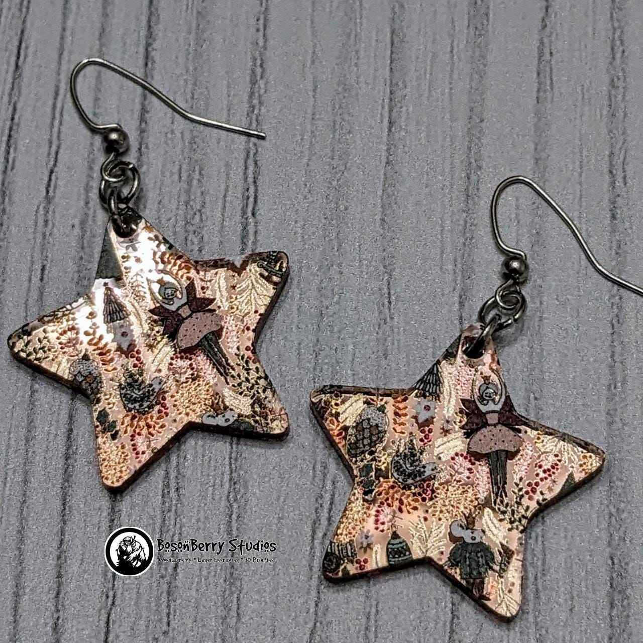 Star-shaped Nutcracker Rose-Gold Mirrored Acrylic Earrings on white background