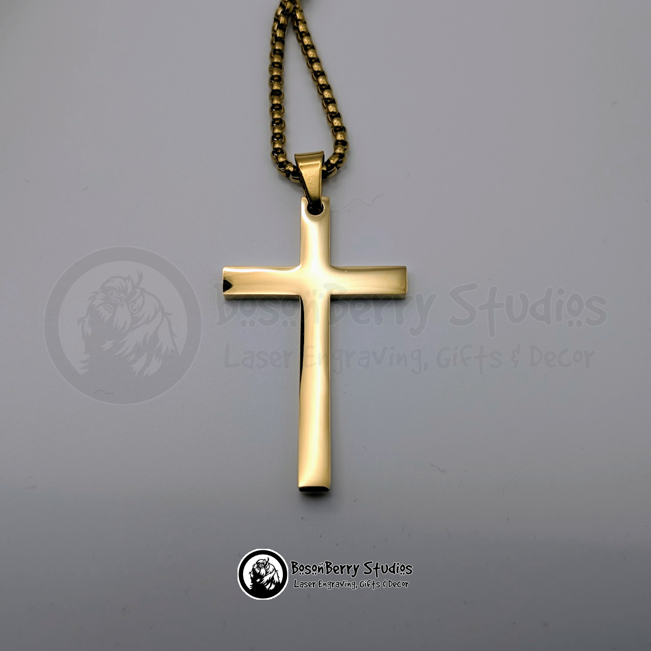 Gold large cross pendant on a white background with 'BosonBerry Studios' branding.