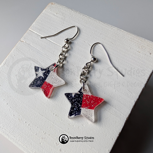Star-shaped US flag glitter earrings on a white background, branded 'BosonBerry Studios'.