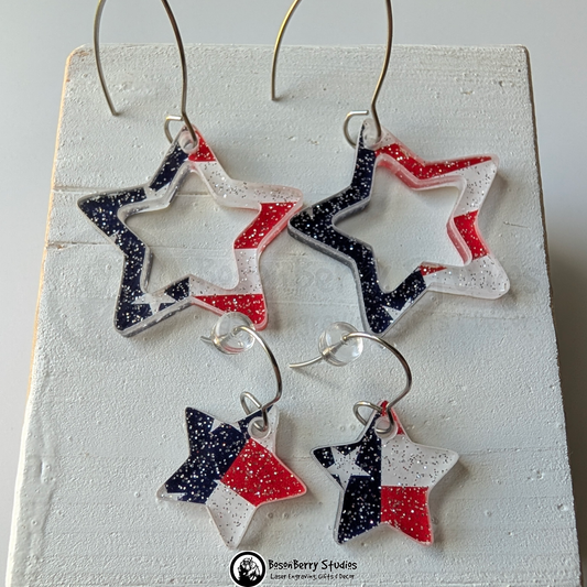 Star-shaped US Flag glitter earrings on a white background, branded 'BosonBerry Studios'.