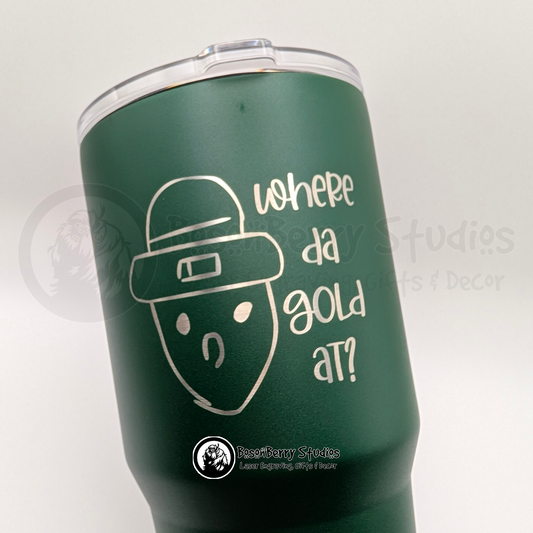 Green travel mug engraved with the Crichton Leprechaun and text on a white background