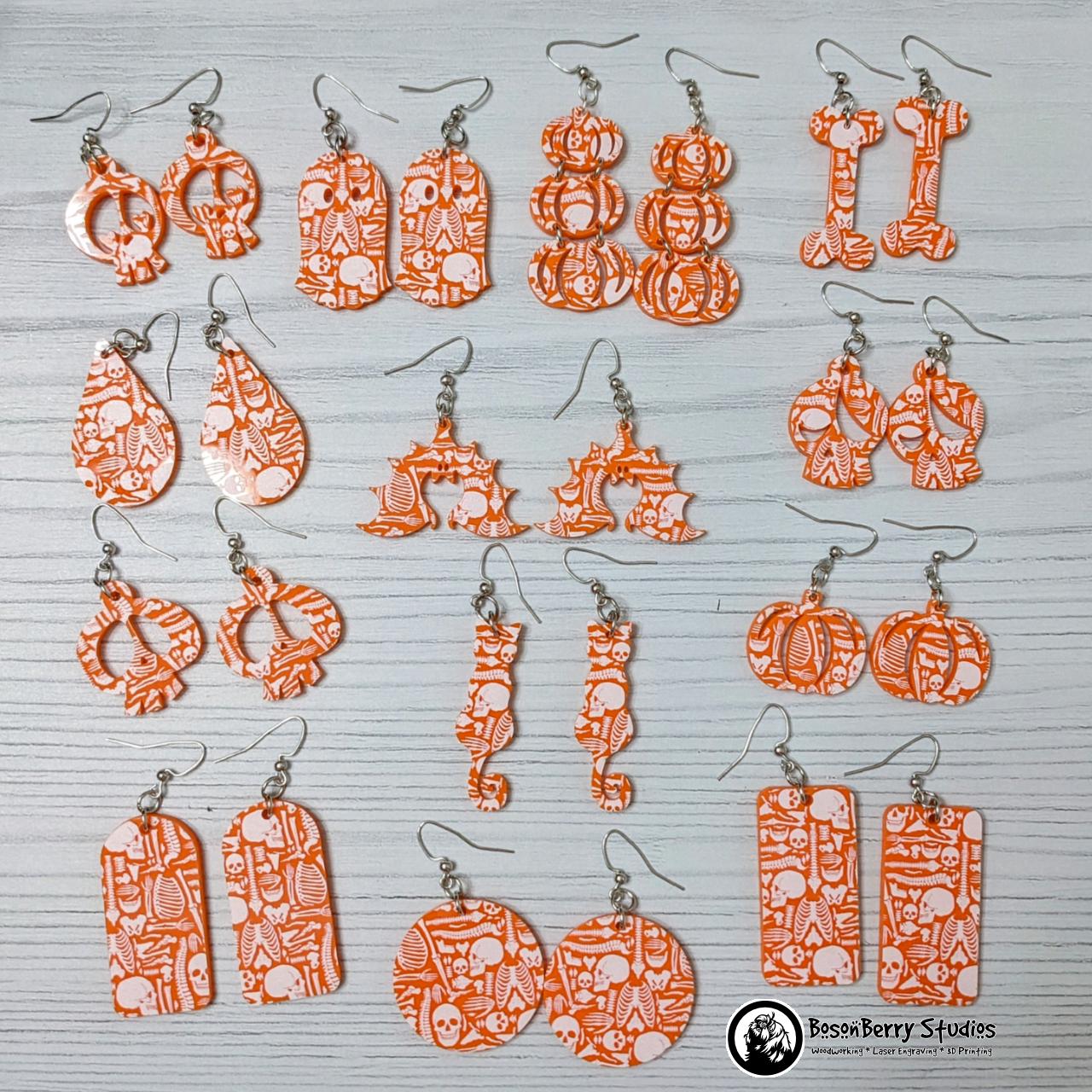 Acrylic "Scattered Bones on Orange" Earrings | Halloween Spooky Fun Fall | Skull Bone Cat Bat Pumpkin Shapes | Laser Cut