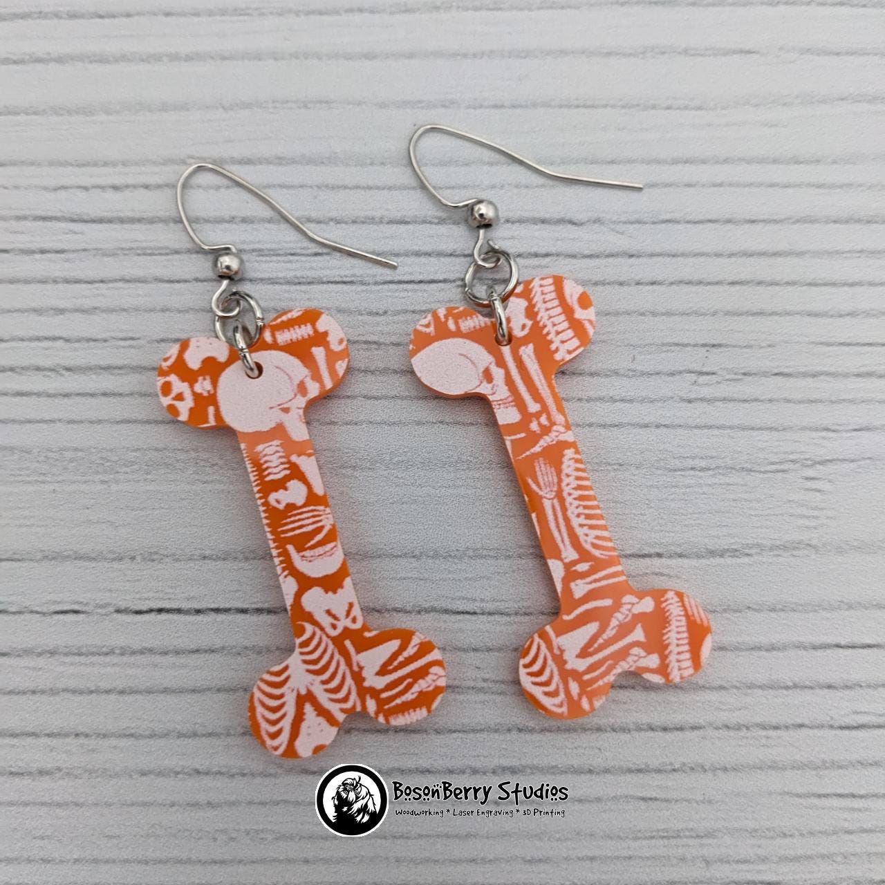 Acrylic "Scattered Bones on Orange" Earrings | Halloween Spooky Fun Fall | Skull Bone Cat Bat Pumpkin Shapes | Laser Cut
