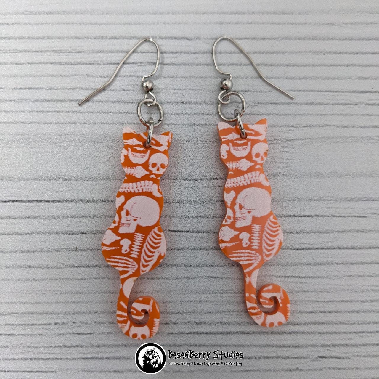 Acrylic "Scattered Bones on Orange" Earrings | Halloween Spooky Fun Fall | Skull Bone Cat Bat Pumpkin Shapes | Laser Cut